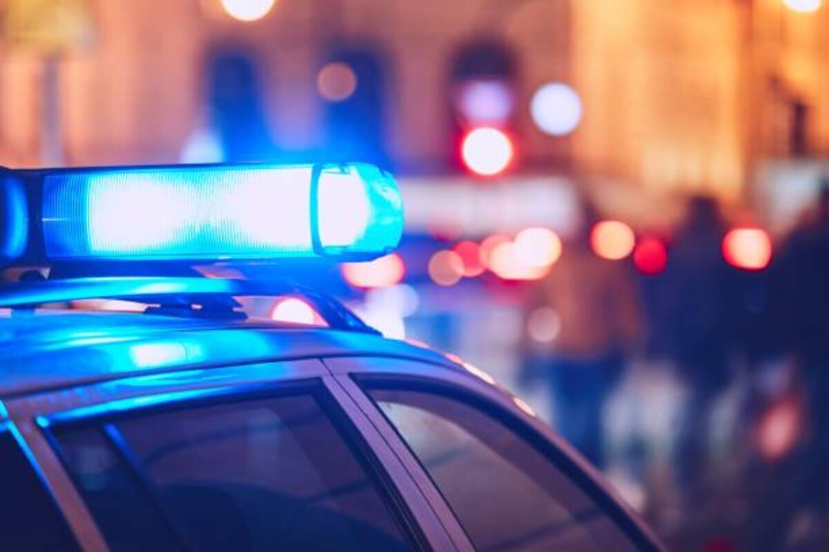 Danger on the street. Blue flasher on the police car at night. Danger on the street. Blue flasher on the police car at night.